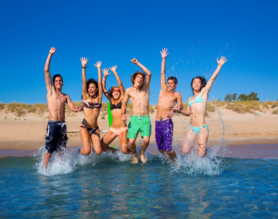 Teen Boys and Girls Beach Jumping